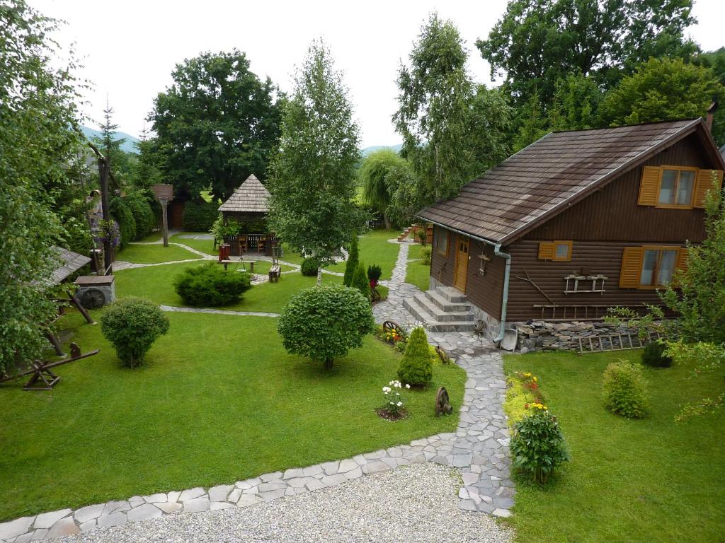 a model of a house and a yard with a house at Nagy Lak I. in Sub Cetate