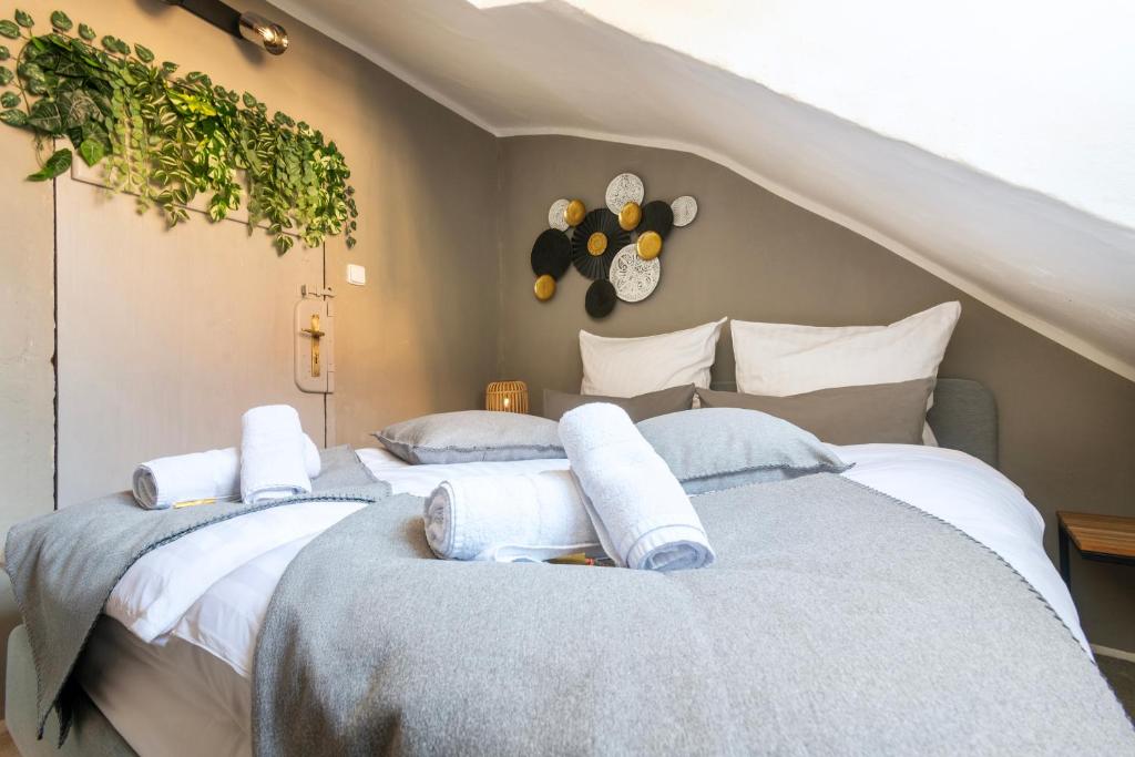two beds in a room with a staircase at 20 seconds to Charles Bridge in Prague