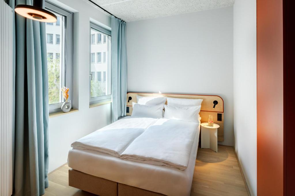 Postel nebo postele na pokoji v ubytování DEIN APART München