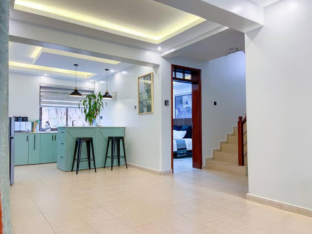 a kitchen with a blue counter in a room at Bethel apartments ug in Kampala