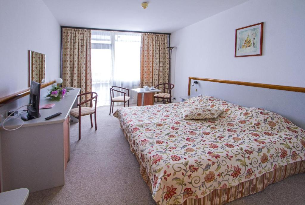Postel nebo postele na pokoji v ubytování Hotel Samokov