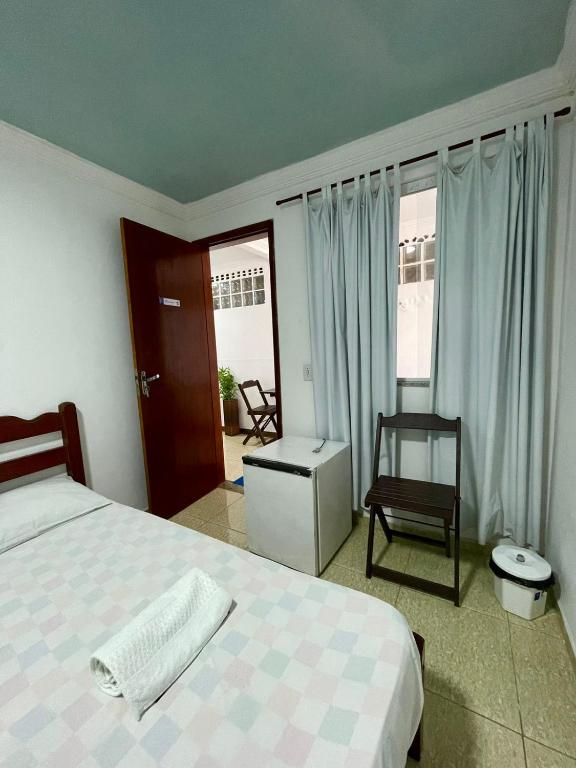 Cama ou camas em um quarto em Pousada Bellmar - Praia Peró 5 min andando