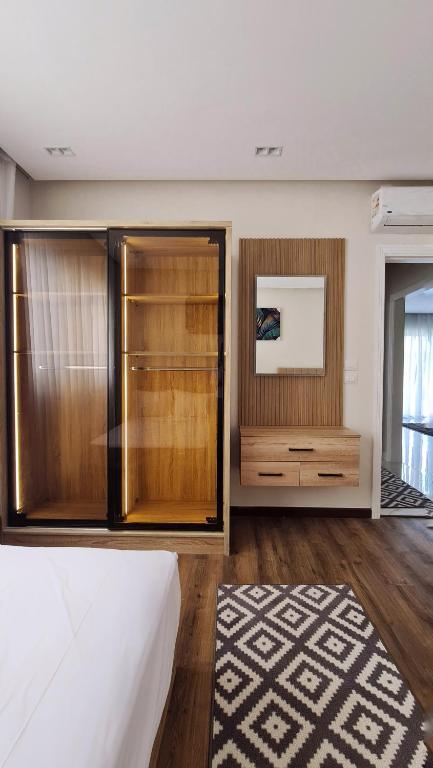 Voodi või voodid majutusasutuse Axxodia- Apartments In Lake View Residence toas