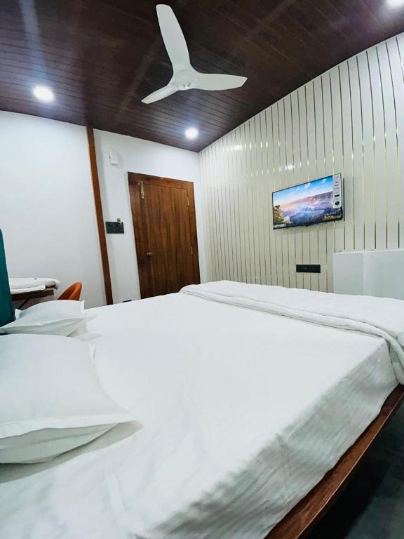 Postel nebo postele na pokoji v ubytování Hotel M Hyatt