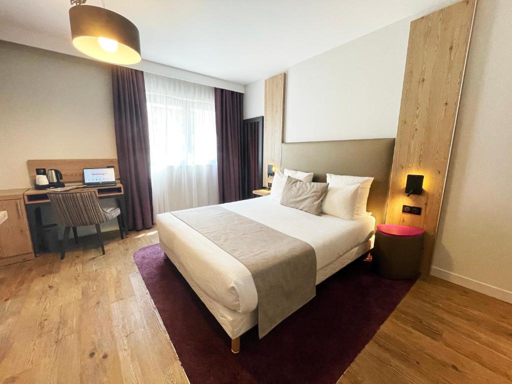 Postel nebo postele na pokoji v ubytování Hôtel Maison Turenne