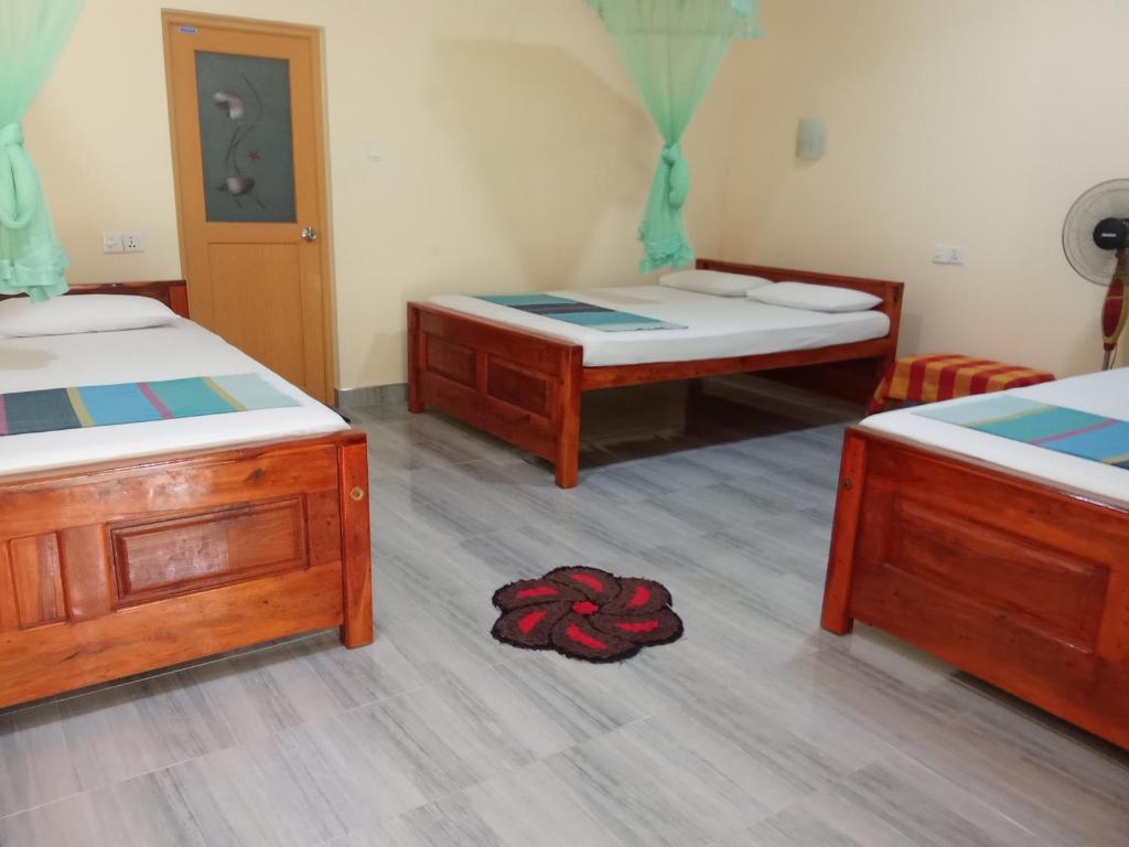 Postel nebo postele na pokoji v ubytování Udesh Guest