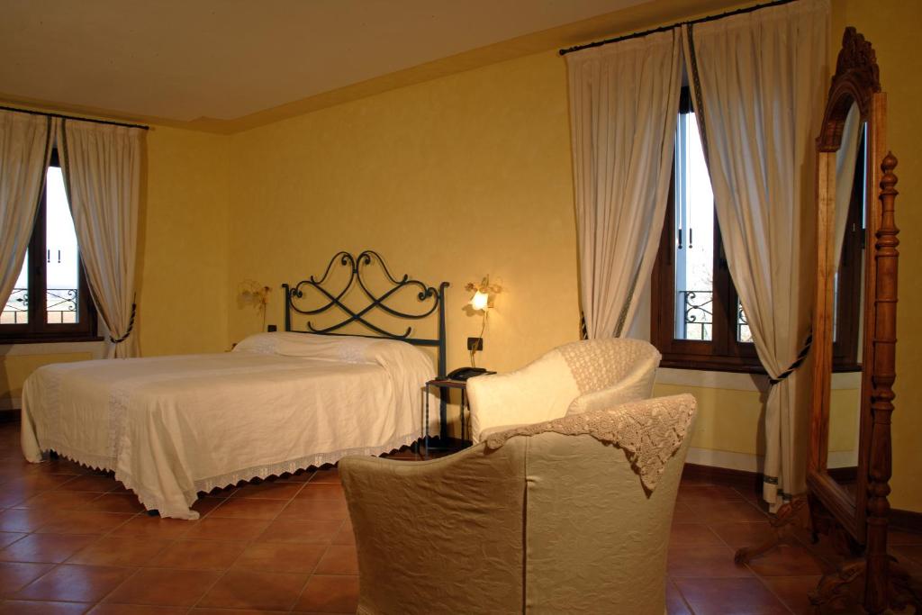 Postel nebo postele na pokoji v ubytování Agriturismo Macesina