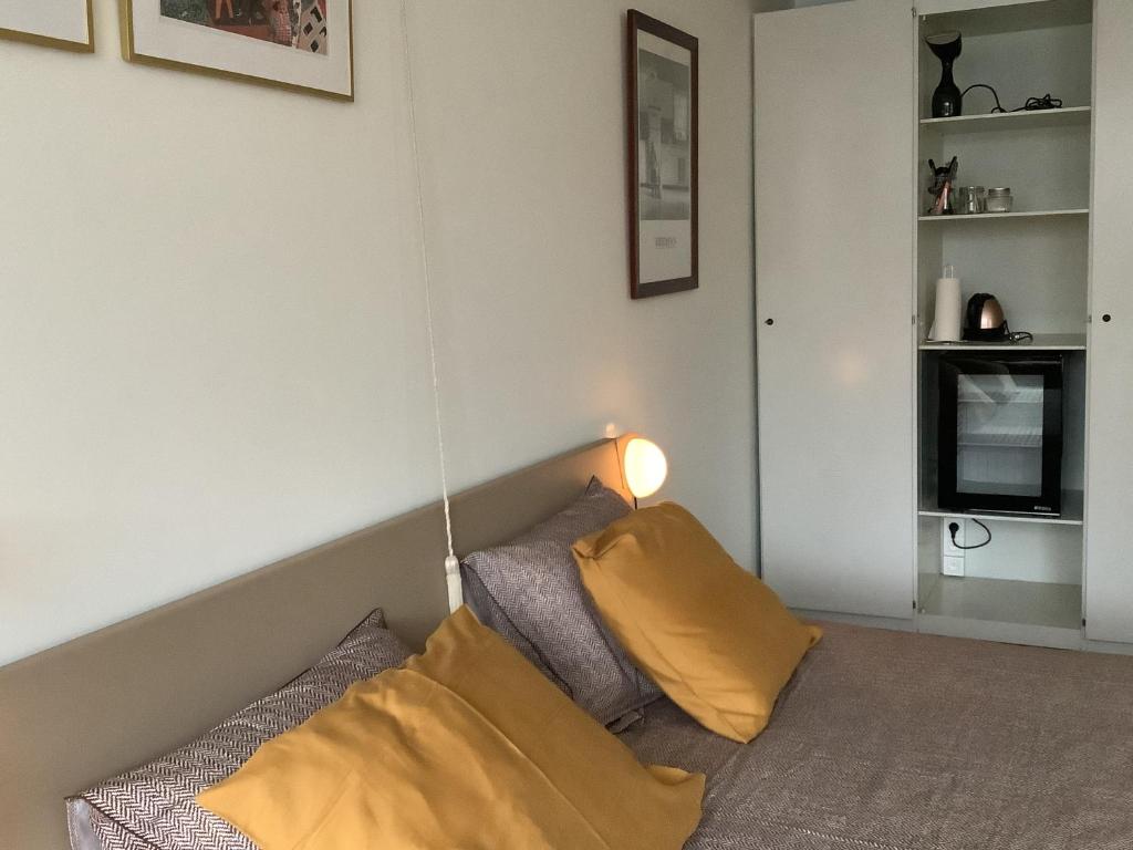 Postel nebo postele na pokoji v ubytování Noir de Noir Bruges