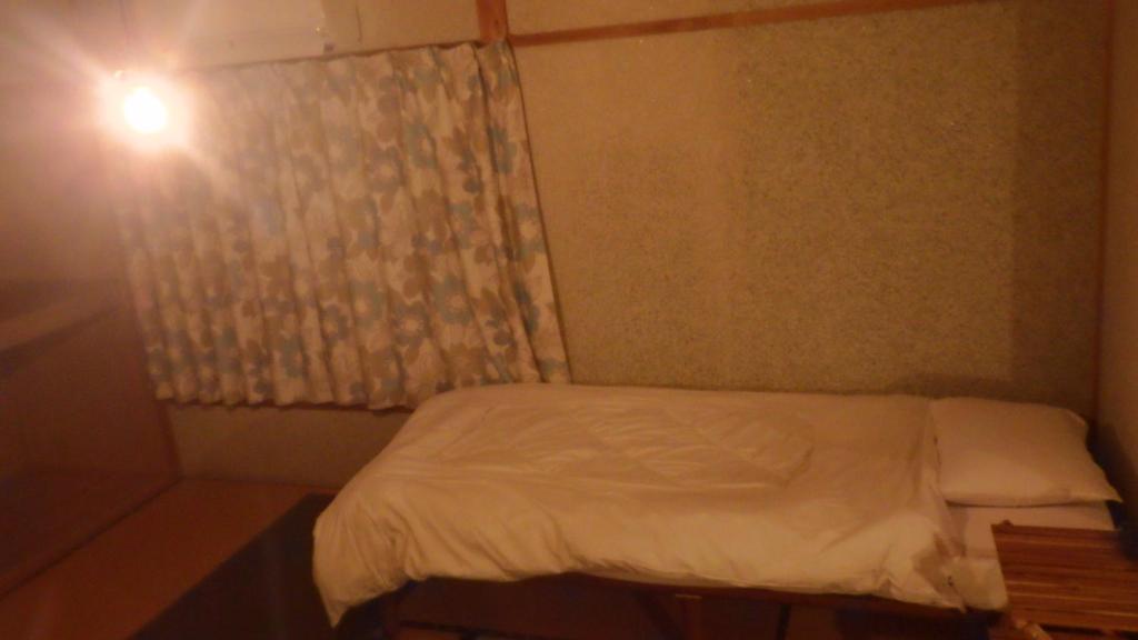 Cosmos Guesthouse Iya Valleyにあるベッド