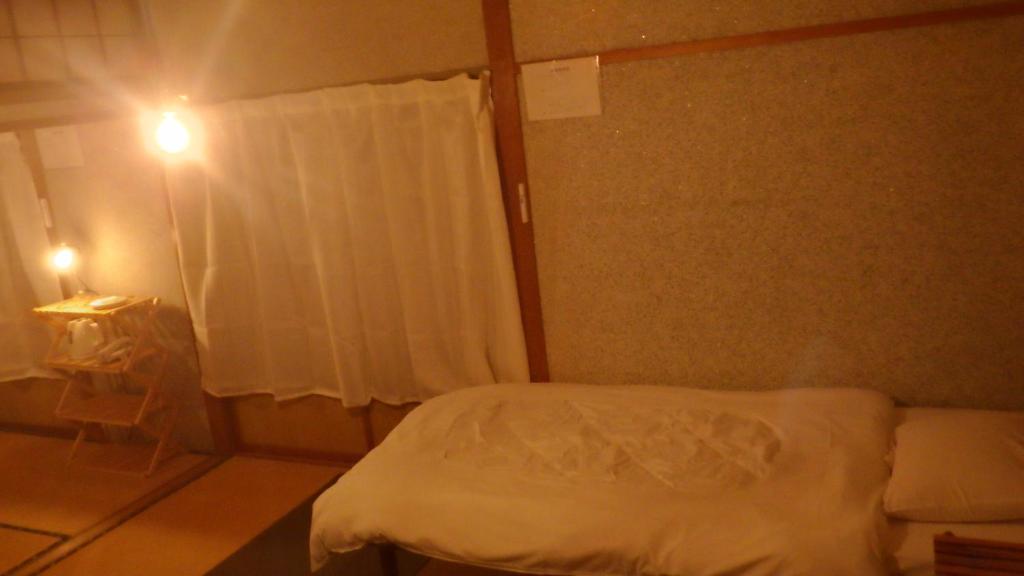 Cosmos Guesthouse Iya Valleyにあるベッド