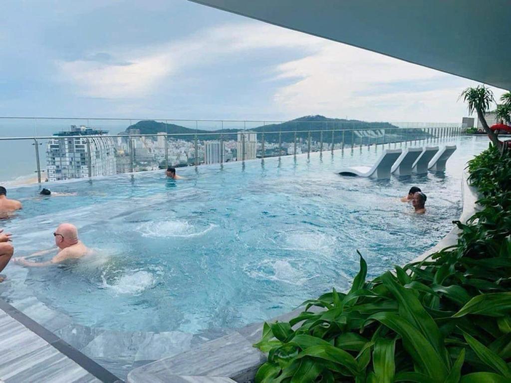 a group of people in a swimming pool on a building at The Sóng Vũng tàu -Thuỷ còi in Vung Tau