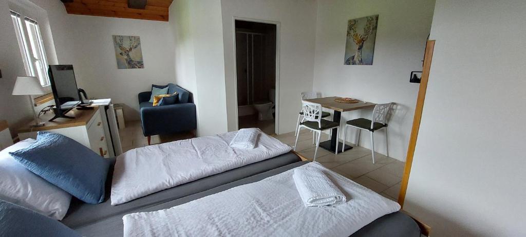 Postel nebo postele na pokoji v ubytování Penzion SLUPEČNÁ