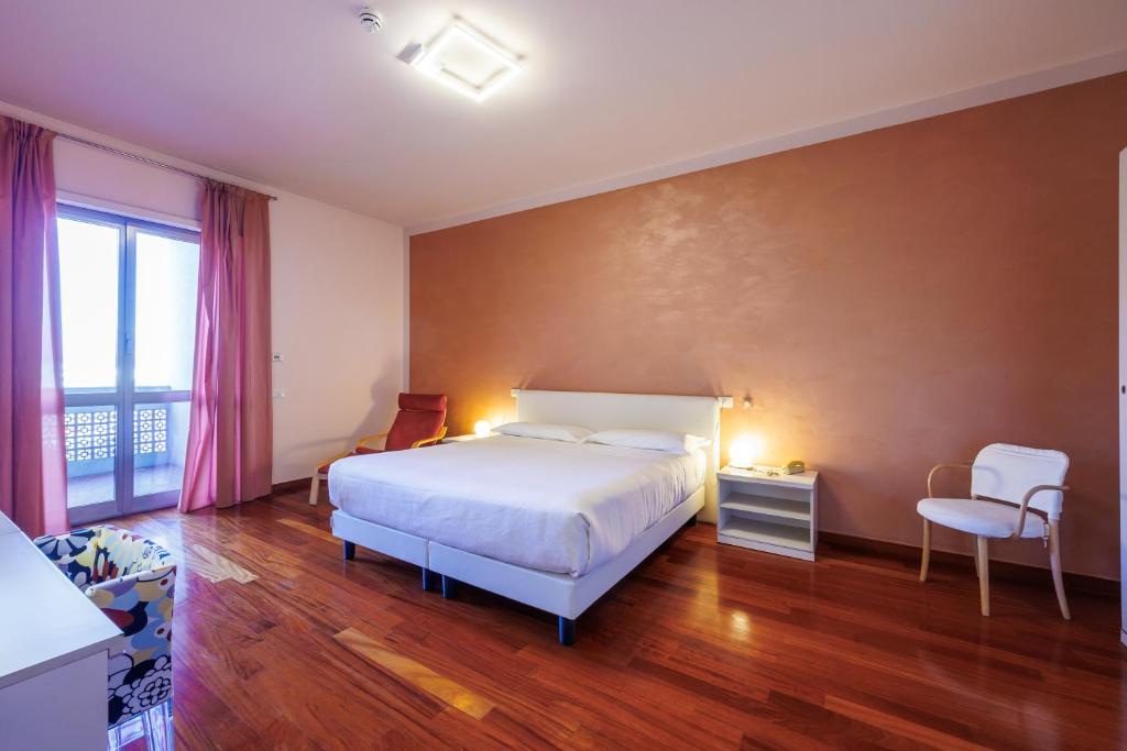 Postel nebo postele na pokoji v ubytování Residence Hotel Torino Uno