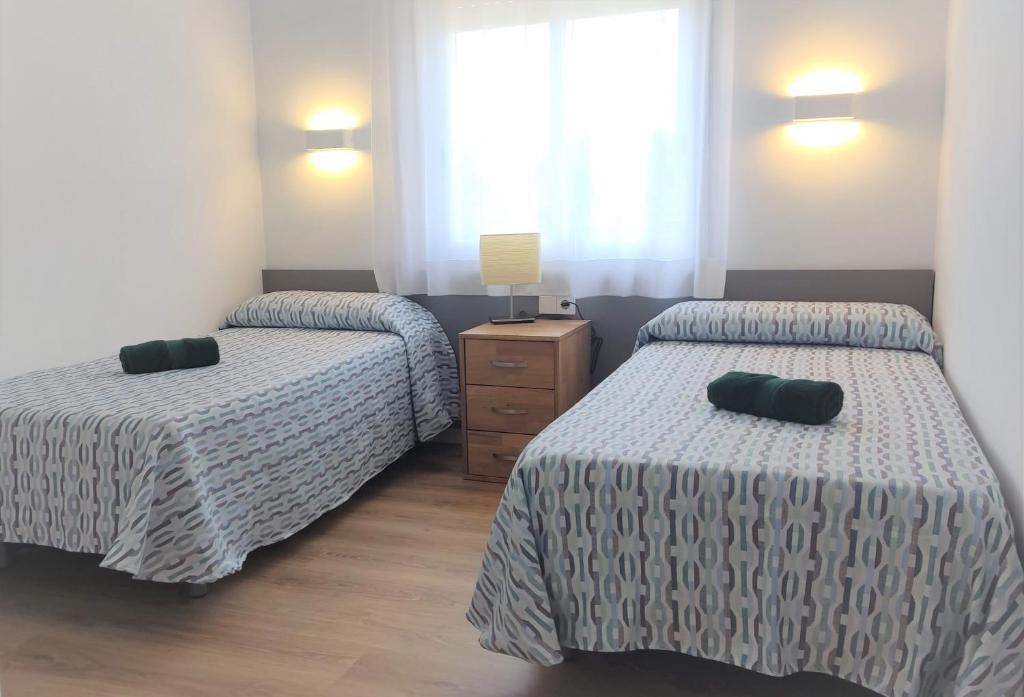 Postel nebo postele na pokoji v ubytování Apartamento 2H frente al mar y piscina 423