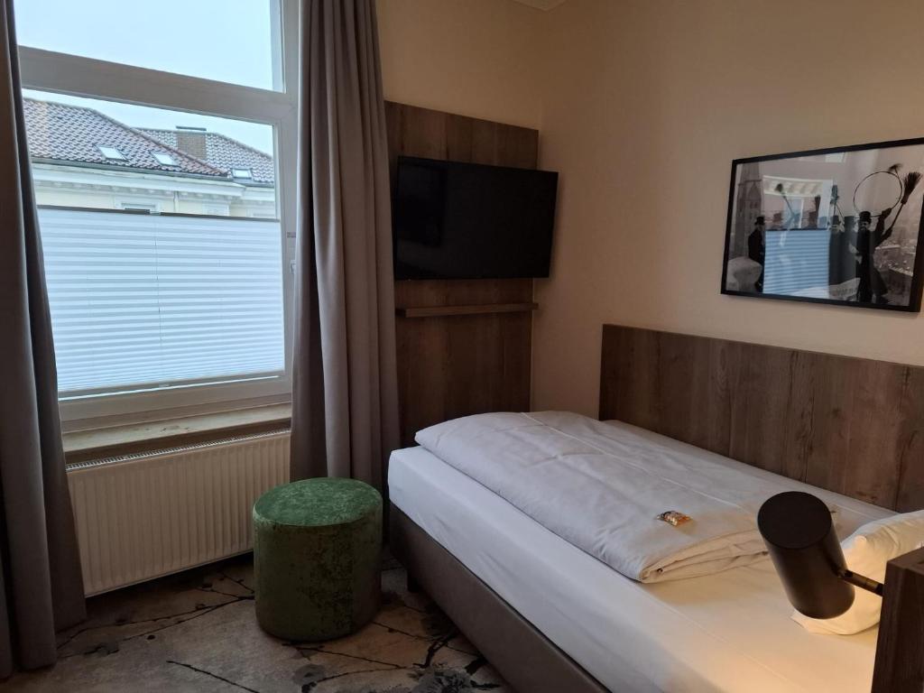 Postel nebo postele na pokoji v ubytování LIHO - einfach Lübeck