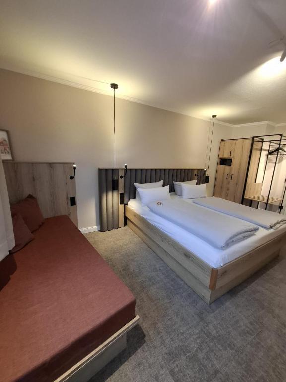 Postel nebo postele na pokoji v ubytování LIHO - einfach Lübeck