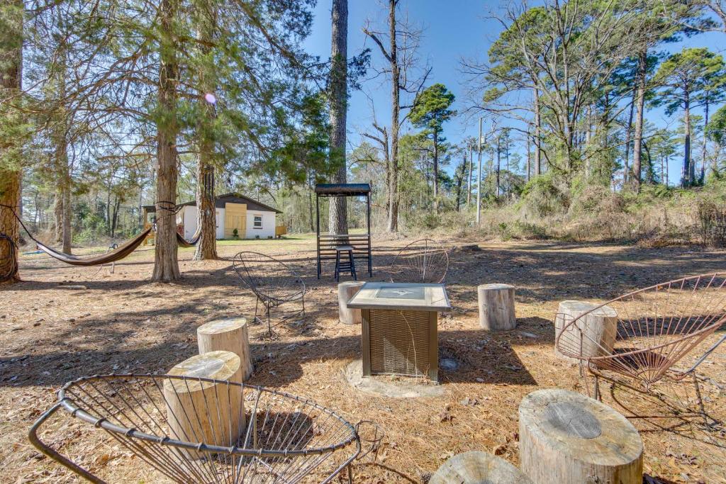 a park with a swing set in the woods at Winnsboro Home on 17 Acres Outdoor Spots and Trails in Winnsboro