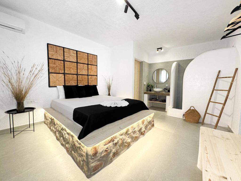 a bedroom with a large bed in a room at LA Casa Di Lusso Casa N2 Adults Only in Kolimbia