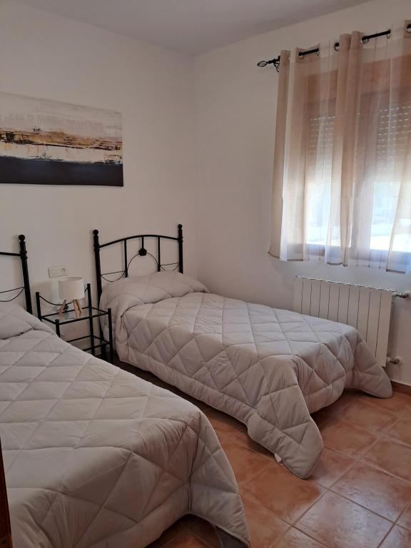 Postel nebo postele na pokoji v ubytování Cortijo Ojos del Prado