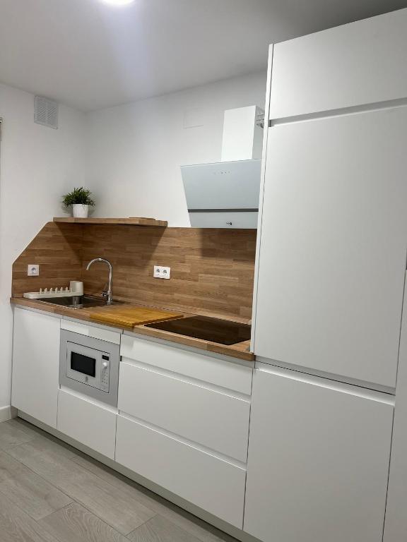 Kuchyň nebo kuchyňský kout v ubytování Apartamentos Ortega