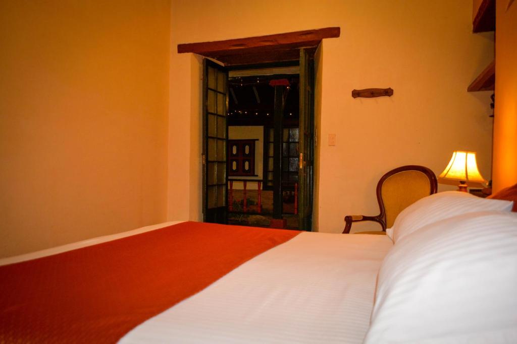 Postel nebo postele na pokoji v ubytování la posada del angel