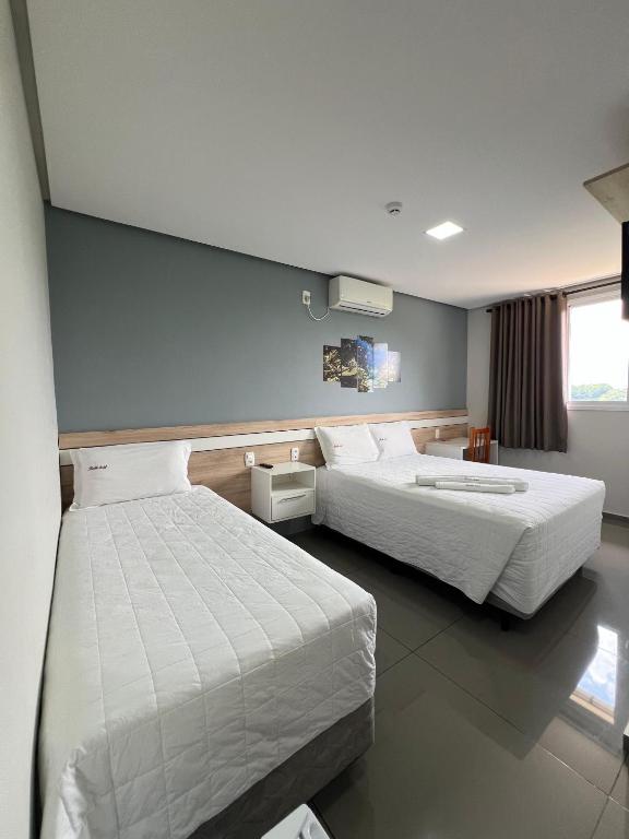 Postel nebo postele na pokoji v ubytování RUBBO HOTEL