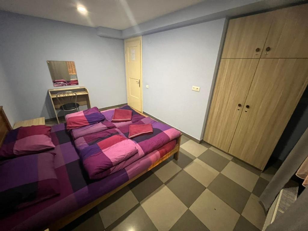 Postel nebo postele na pokoji v ubytování Galaxy Hostel