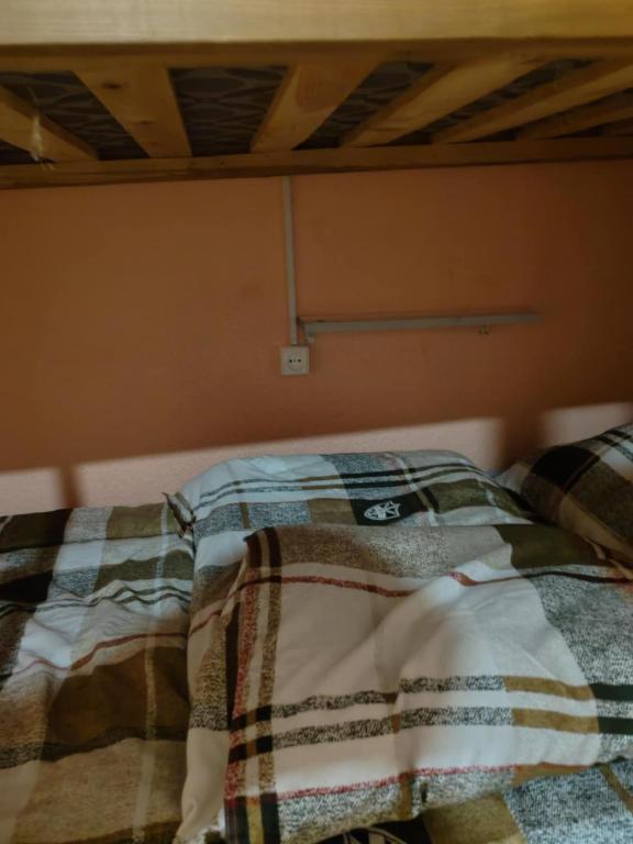 Postel nebo postele na pokoji v ubytování Galaxy Hostel