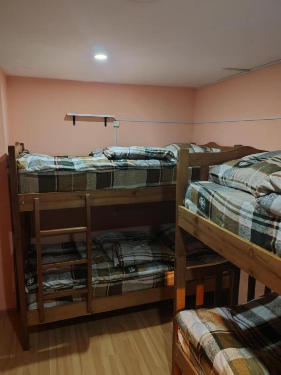 Postel nebo postele na pokoji v ubytování Galaxy Hostel
