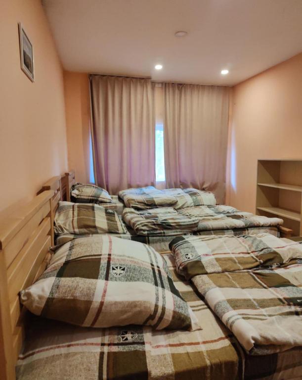 Postel nebo postele na pokoji v ubytování Galaxy Hostel