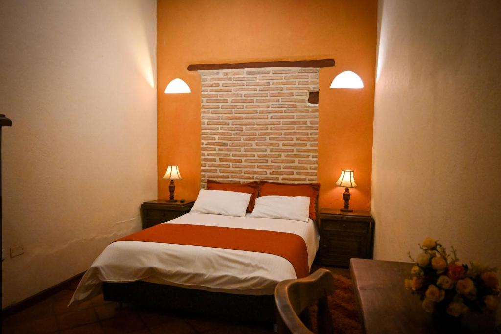 Postel nebo postele na pokoji v ubytování la posada del angel