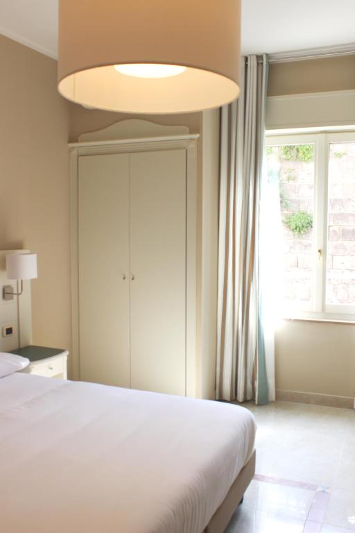 Postel nebo postele na pokoji v ubytování Astoria Hotel