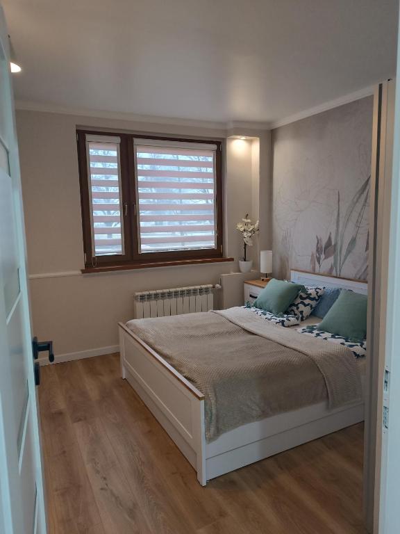 Postel nebo postele na pokoji v ubytování Cosy Space Apartment