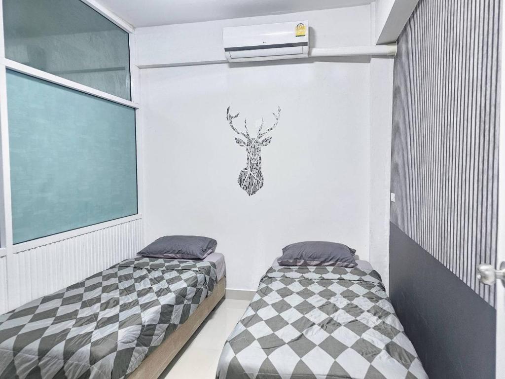 Postel nebo postele na pokoji v ubytování Future Hostel Pattaya