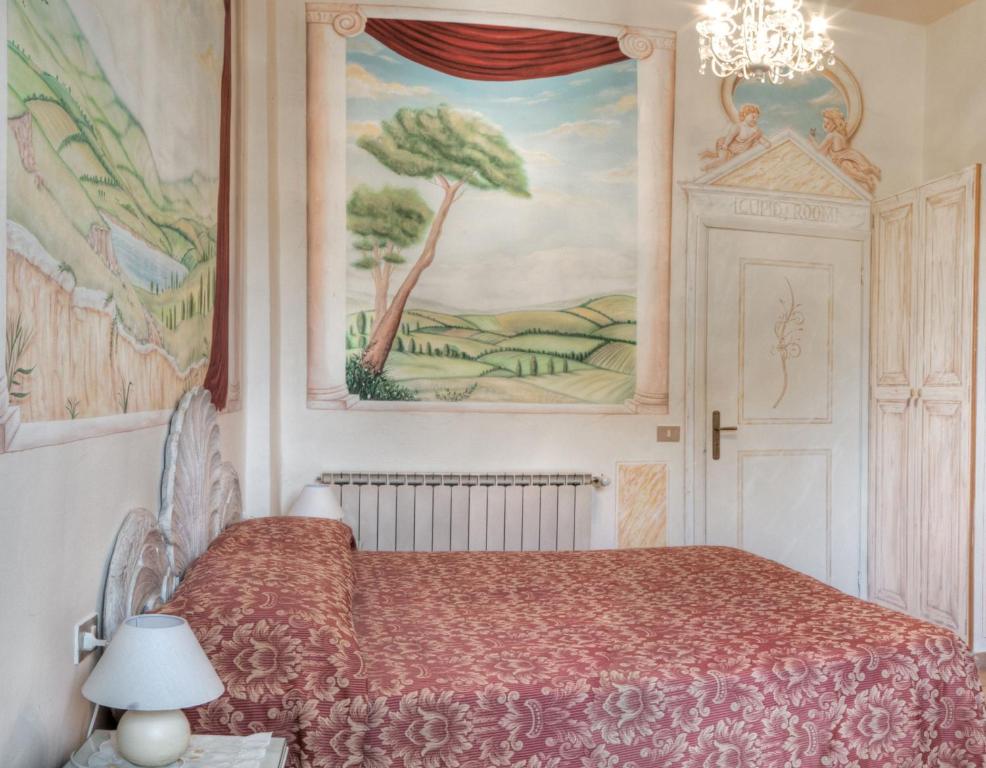 Postel nebo postele na pokoji v ubytování Hotel Masaccio