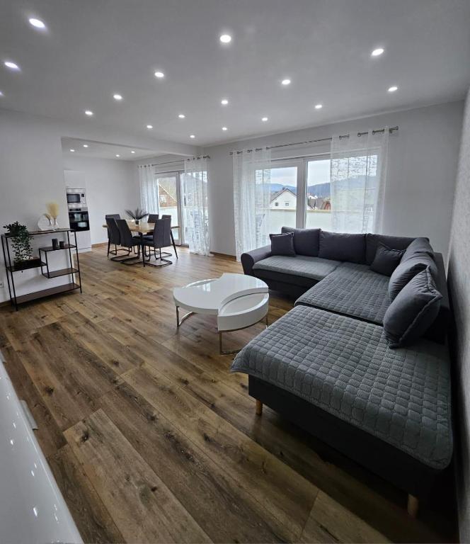 a living room with a couch and a table at Ferienwohnung in Bad Laasphe