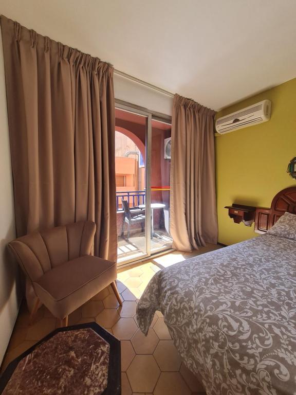 Postel nebo postele na pokoji v ubytování Hotel Tachfine
