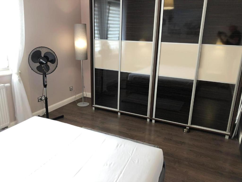 Posteľ alebo postele v izbe v ubytovaní Apartamenty Plaza Słupca