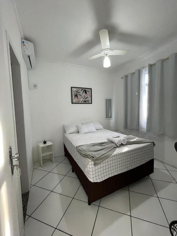 Postel nebo postele na pokoji v ubytování Hotel Aconchegante