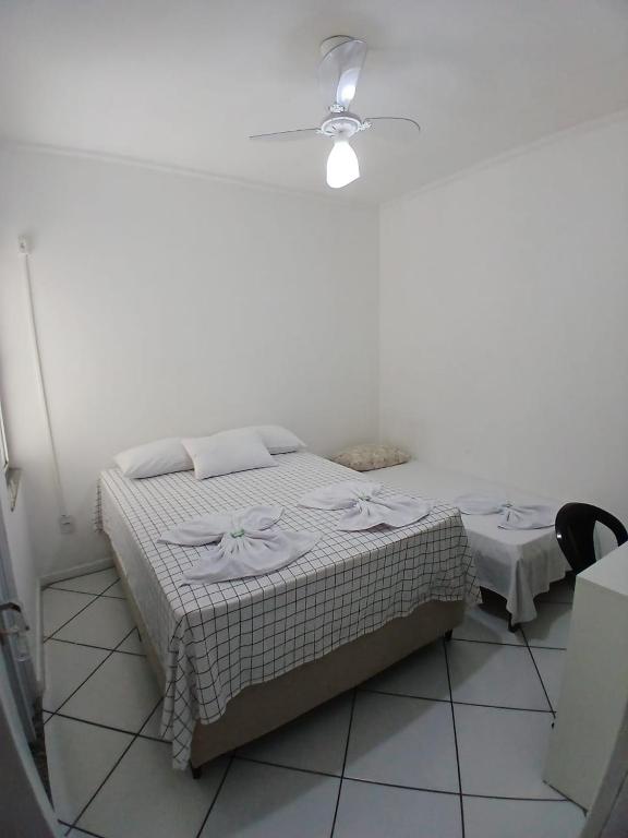 Postel nebo postele na pokoji v ubytování Hotel Aconchegante