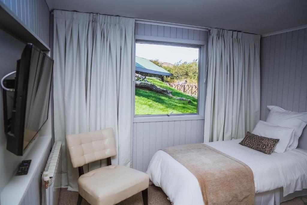 Postel nebo postele na pokoji v ubytování Hotel Lago Grey