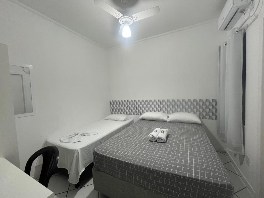 Postel nebo postele na pokoji v ubytování Hotel Aconchegante