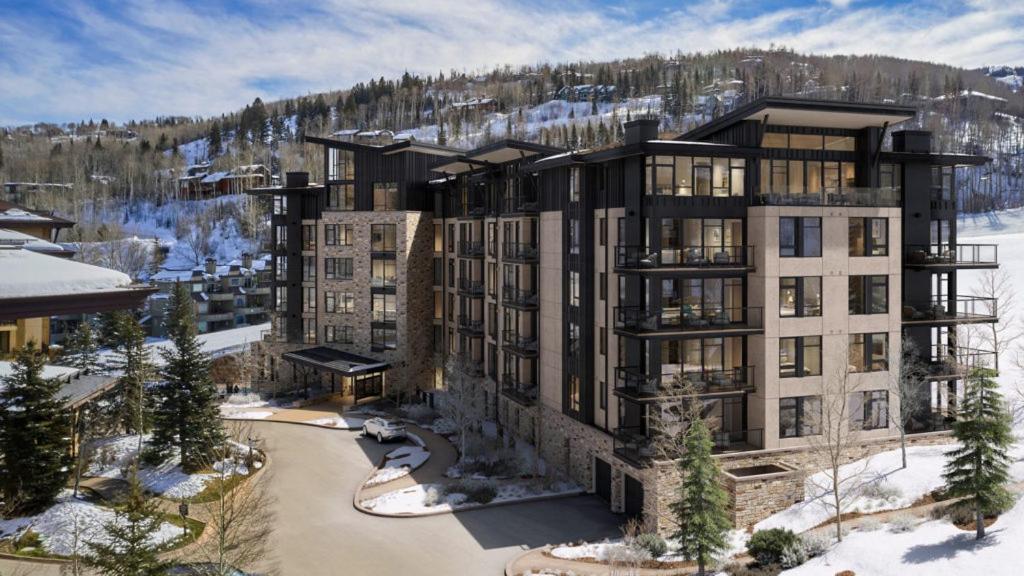 a rendering of a large building in the snow at Snowmass Lux Getaway by Snowmass Vacations in Snowmass Village