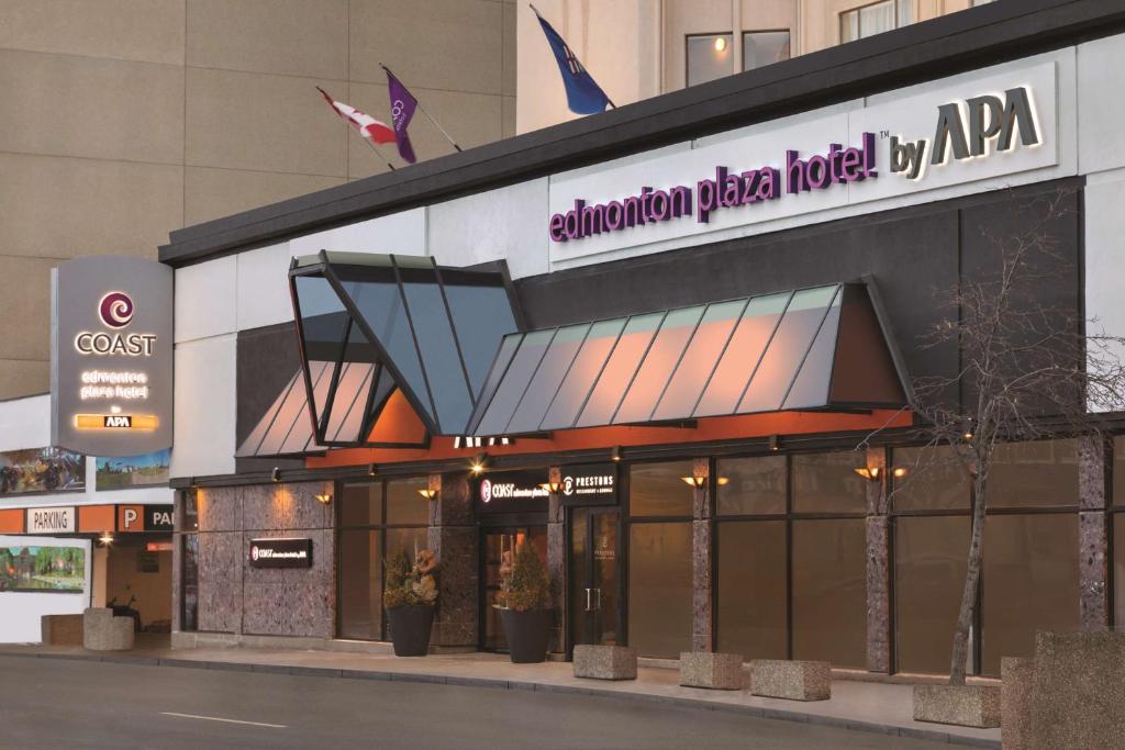 a building with a sign for a hotel at Coast Edmonton Plaza Hotel by APA in Edmonton