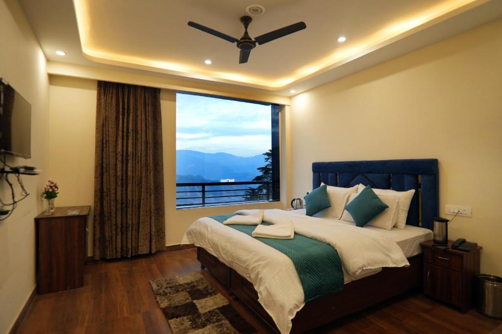 Postel nebo postele na pokoji v ubytování Ambrosia Grand