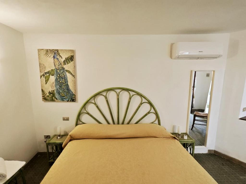 Postel nebo postele na pokoji v ubytování Hotel Golfo Azzurro