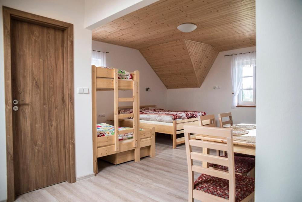 Postel nebo postele na pokoji v ubytování Penzion U Červené podkovy