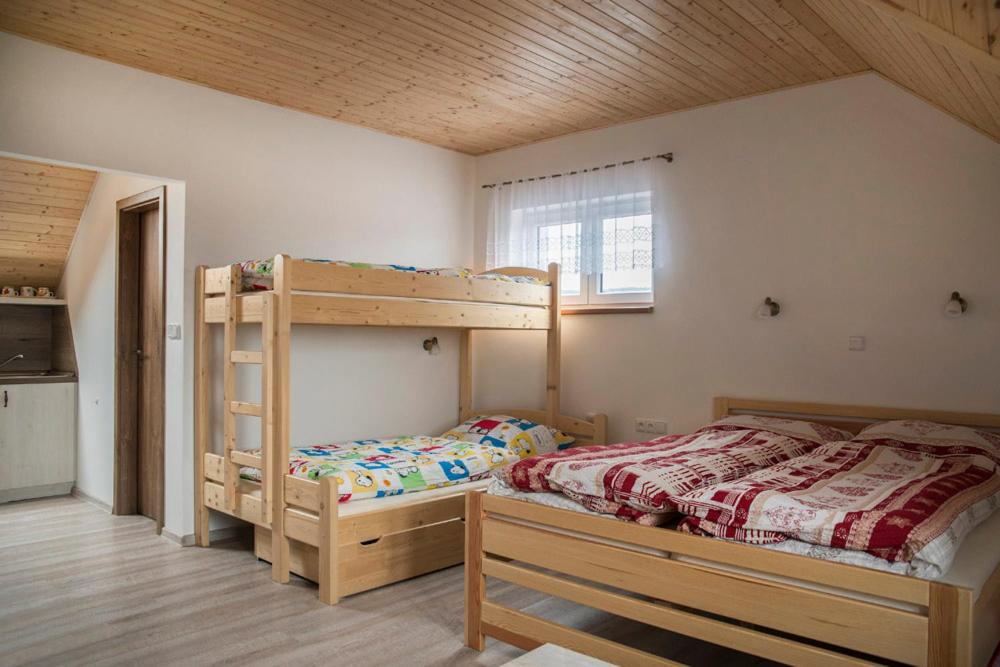 Postel nebo postele na pokoji v ubytování Penzion U Červené podkovy