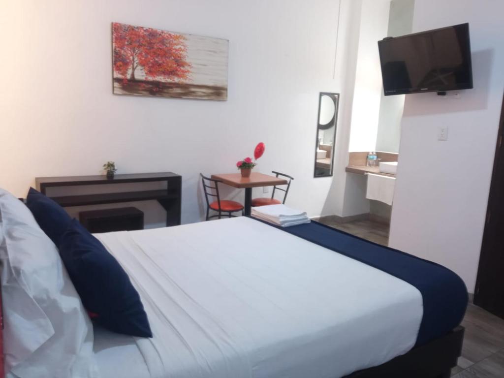 Postel nebo postele na pokoji v ubytování Hotel Gandag