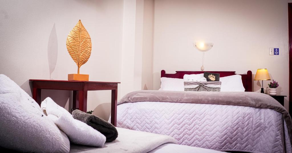Postel nebo postele na pokoji v ubytování UKUKU Hostel